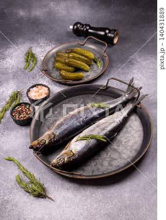 Salted herring with pickled cucumbers and spices Salted herring with pickled cucumbers and spices 140431889