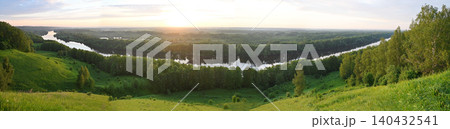 Panorama of a wide winding river flowing through dense forest Panorama of a wide winding river flowing through dense forest 140432541