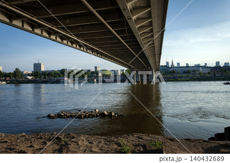View of the Vistula River in Warsaw and a bridge overlooking the city 140432689