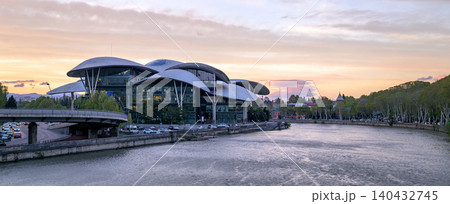 Panoramic sunset view of Public Service Hall agency of the Georgian government and Mtkvari river in Tbilisi, Georgia 140432745