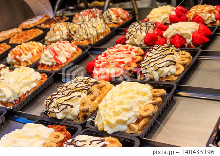 Belgian waffles with colorful sweet toppings and fruits for sale in Brussels, Belgium Belgian waffles with colorful sweet toppings and fruits for sale in Brussels, Belgium 140433196