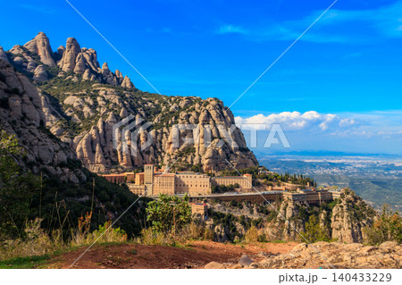 View of the famous Santa Maria de Montserrat Abbey located on the mountain of Montserrat nearby from Barcelona in Catalonia, Spain. Montserrat Monastery View of the famous Santa Maria de Montserrat Abbey located on the mountain of Montserrat nearby from Barcelona in Catalonia, Spain. Montserrat Monastery 140433229
