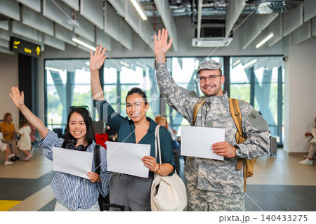 Military man and family welcoming home at airport 140433275