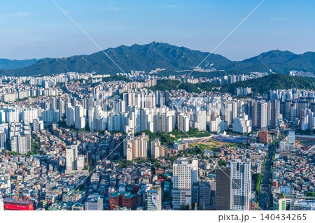 High-angle panoramic view of dense residential apartment complexes and urban cityscape in southern Seoul on a clear summer day 140434265