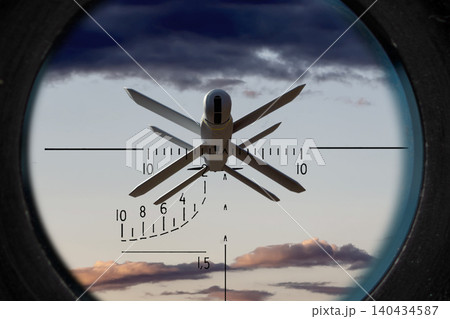 Military drone is observed through optical scope against cloudy sky. Military drone is observed through optical scope against cloudy sky. 140434587