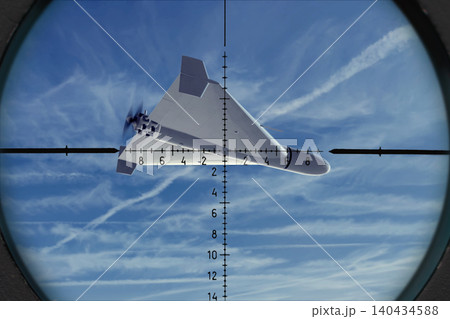 Strike drone is positioned in center of targeting reticle against sky. Strike drone is positioned in center of targeting reticle against sky. 140434588