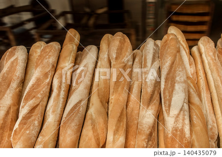 Fresh baked goods bakery loaf baguette bread wheat food background Fresh baked goods bakery loaf baguette bread wheat food background 140435079