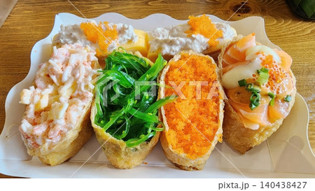 Assorted Inari Sushi with Colorful Toppings in a Paper Tray Assorted Inari Sushi with Colorful Toppings in a Paper Tray 140438427