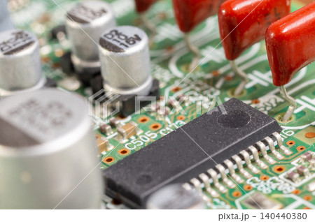 Close-up view of a circuit board with electronic components and connectors. Close-up view of a circuit board with electronic components and connectors. 140440380