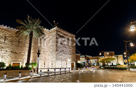 Beautifully illuminated Najdi style architecture at Bujairi Terrace in the historic district of Diriyah, Saudi Arabia at night. 140441000