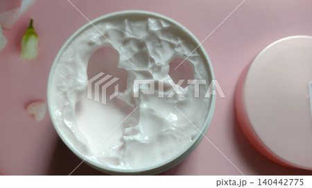 Moisturizing body butter or face mask in a plastic container, beauty and skincare concept. 140442775