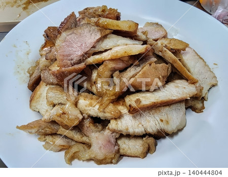 Delicious Thai Grilled Pork Neck Kor Moo Yang Sliced on White Plate Delicious Thai Grilled Pork Neck Kor Moo Yang Sliced on White Plate 140444804
