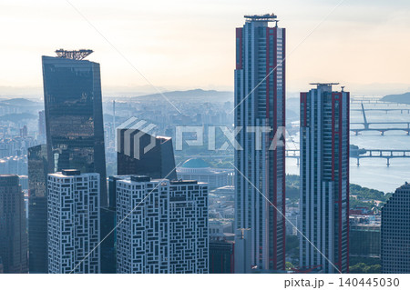 High-angle panoramic view of Yeouido financial district skyscrapers and the Han River on a clear summer afternoon in Seoul, South Korea High-angle panoramic view of Yeouido financial district skyscrapers and the Han River on a clear summer afternoon in Seoul, South Korea 140445030