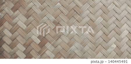 Traditional woven bamboo surface featuring a classic basket weave pattern. Traditional woven bamboo surface featuring a classic basket weave pattern. 140445491