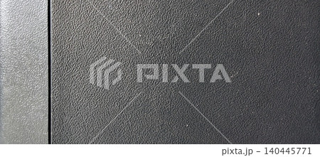 Black textured plastic surface with fine embossed pattern. Black textured plastic surface with fine embossed pattern. 140445771