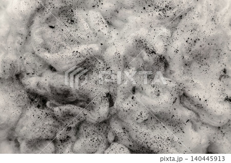 Black charcoal dust scattered on white cotton textured surface, pollution and environmental issue Black charcoal dust scattered on white cotton textured surface, pollution and environmental issue 140445913