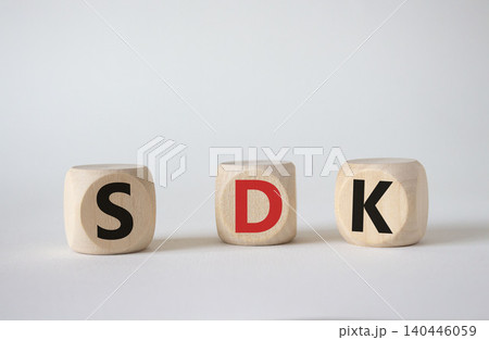 SDK - software development kit. Wooden cubes with word SDK . Beautiful white background. Business and software development kit concept. Copy space. 140446059
