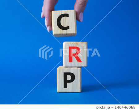 CRP - C-Reactive Protein Test symbol. Wooden cubes with word CRP. Doctor hand. Beautiful blue background. Medical and C-Reactive Protein Test concept. Copy space. CRP - C-Reactive Protein Test symbol. Wooden cubes with word CRP. Doctor hand. Beautiful blue background. Medical and C-Reactive Protein Test concept. Copy space. 140446069