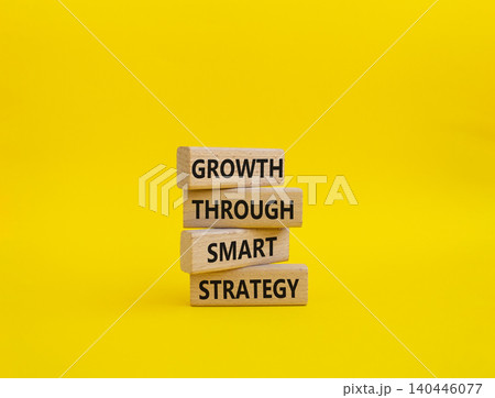 Smart strategy symbol. Wooden blocks with words Growth through smart strategy. Beautiful yellow background. Business and Smart strategy concept. Copy space Smart strategy symbol. Wooden blocks with words Growth through smart strategy. Beautiful yellow background. Business and Smart strategy concept. Copy space 140446077