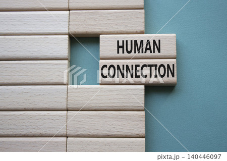 Human Connection symbol. Concept word Human Connection on wooden blocks. Beautiful grey green background. Business and Human Connection concept. Copy space Human Connection symbol. Concept word Human Connection on wooden blocks. Beautiful grey green background. Business and Human Connection concept. Copy space 140446097