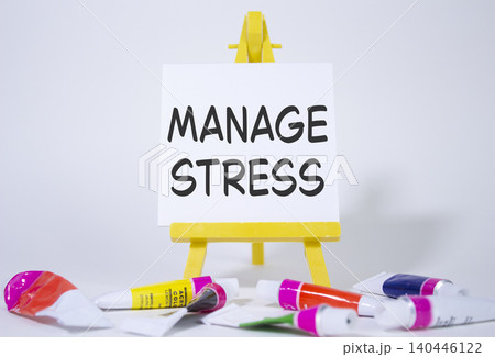 Manage stress symbol. Concept word Manage stress on wooden blocks. Beautiful white background with paints and easel. Business and Manage stress concept. Copy space Manage stress symbol. Concept word Manage stress on wooden blocks. Beautiful white background with paints and easel. Business and Manage stress concept. Copy space 140446122