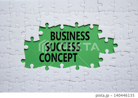 Business Success Concept symbol. White puzzle with words Business Success Concept. Beautiful green background. Business concept. Copy space. Business Success Concept symbol. White puzzle with words Business Success Concept. Beautiful green background. Business concept. Copy space. 140446135