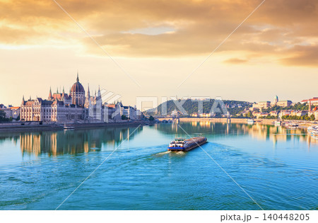 Hungarian Parliament Building at sunset with Danube river and historical bridges Hungarian Parliament Building at sunset with Danube river and historical bridges 140448205