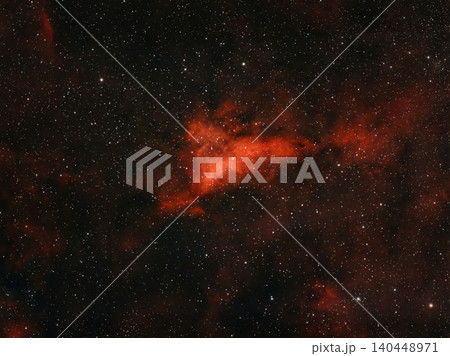 This image shows a red nebula with many stars in the vastness of space. This image shows a red nebula with many stars in the vastness of space. 140448971