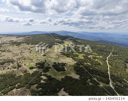 High mountain ridge with hiking trail under cloudy sky High mountain ridge with hiking trail under cloudy sky 140450114