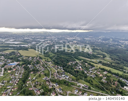 Aerial view of suburban landscape under low storm clouds 140450140