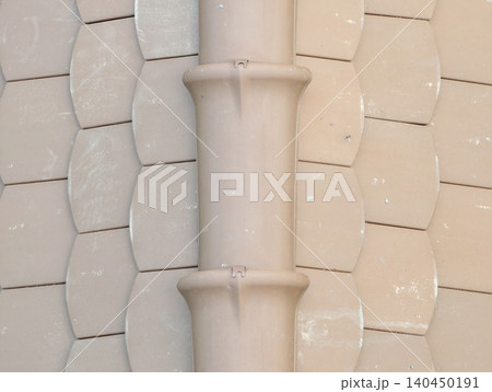 Close-up of beige ceramic roof tiles with central ridge Close-up of beige ceramic roof tiles with central ridge 140450191