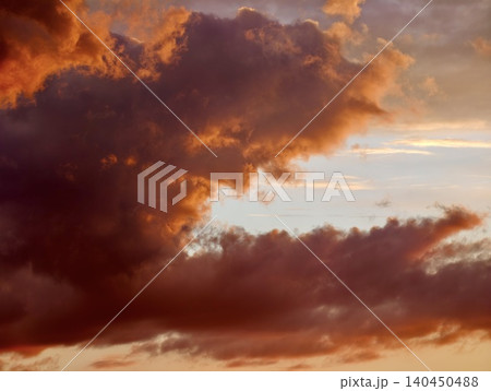 Dramatic sunset clouds over glowing evening sky Dramatic sunset clouds over glowing evening sky 140450488