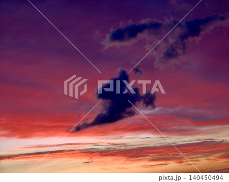 Dramatic colorful sunset sky with dark clouds 140450494