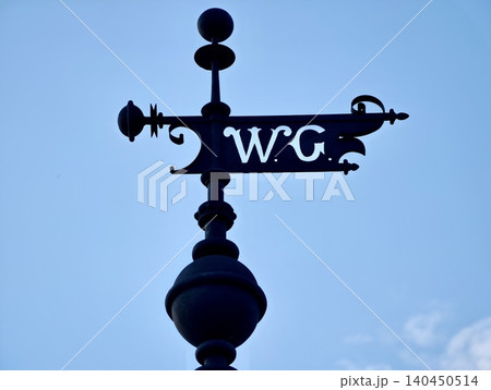 Ornate black W.C. sign against blue sky Ornate black W.C. sign against blue sky 140450514