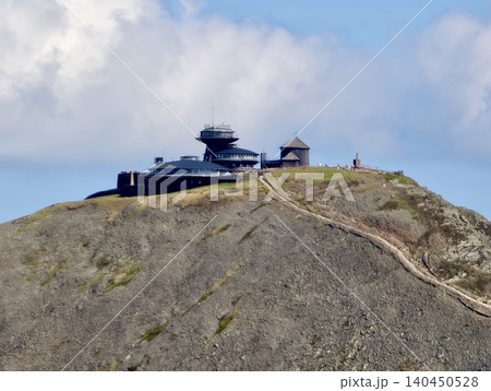 Remote summit building on a rocky mountain ridge 140450528
