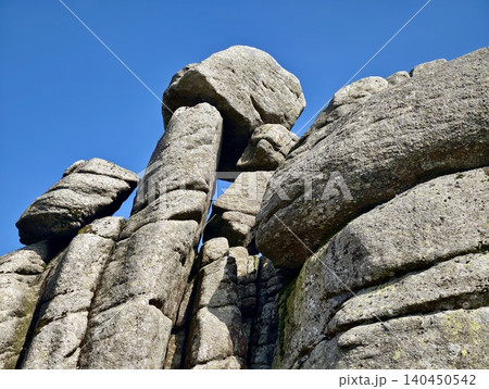 Towering granite rock formation against clear blue sky Towering granite rock formation against clear blue sky 140450542