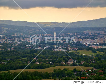 Panoramic cityscape with green valley and distant hills Panoramic cityscape with green valley and distant hills 140450572