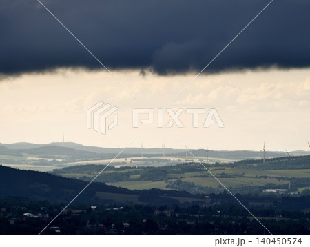 Storm clouds over rolling countryside Storm clouds over rolling countryside 140450574