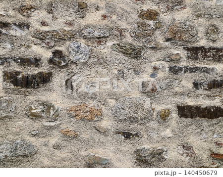 Weathered stone and mortar wall texture with irregular stones Weathered stone and mortar wall texture with irregular stones 140450679