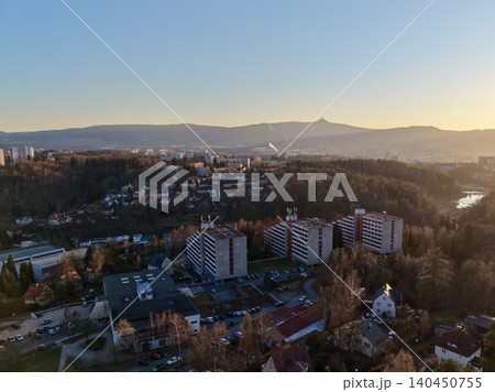Aerial Perspective Of Urban Environment During Sunrise Highlighting Architectural Features And Natural Mist Aerial Perspective Of Urban Environment During Sunrise Highlighting Architectural Features And Natural Mist 140450755