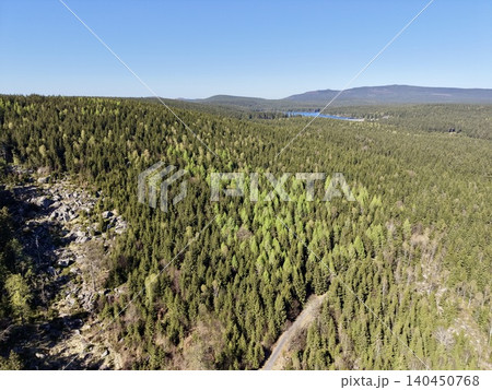 Rugged Ridge With Distant Lake. Vivid Depiction Of Wild Outdoor Scenery And Geological Formations Rugged Ridge With Distant Lake. Vivid Depiction Of Wild Outdoor Scenery And Geological Formations 140450768