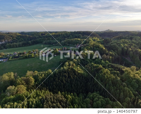 An Aerial Perspective Capturing Rural Outskirts Blending Into Dense Woodlands And Expansive Grasslands 140450797