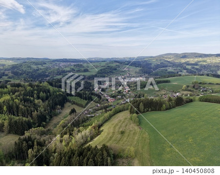 Vast Pastoral Landscape. Sprawling Green Meadows Stretch Into Distant Horizons Under Soft Sunlight Vast Pastoral Landscape. Sprawling Green Meadows Stretch Into Distant Horizons Under Soft Sunlight 140450808