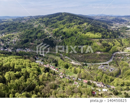 Scenic Settlement Amid Lush Landscapes. Settlement Surrounded By Verdant Hills And Open Fields Scenic Settlement Amid Lush Landscapes. Settlement Surrounded By Verdant Hills And Open Fields 140450825