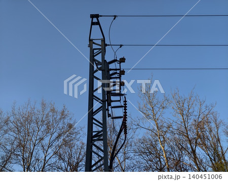 Metal Tower Scene. Electrical Poles And Wires Symbolizing Sustainable Energy Development In Countryside 140451006