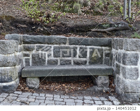 Quiet Park Scene Featuring Old Mosscovered Stone Bench Amidst Autumn Leaves And Historic Surroundings Quiet Park Scene Featuring Old Mosscovered Stone Bench Amidst Autumn Leaves And Historic Surroundings 140451012