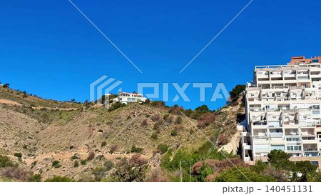 The Stunning Hillside Homes Are Beautifully Set Against a Brilliant Blue Sky Above Them The Stunning Hillside Homes Are Beautifully Set Against a Brilliant Blue Sky Above Them 140451131