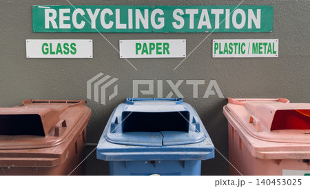 Recycling station with designated bins for glass paper and plastic metal 140453025