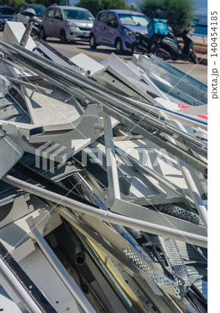 Pile of scrap metal pipes, tubes and steel construction debris stacked at recycling yard, industrial waste materials for reuse Pile of scrap metal pipes, tubes and steel construction debris stacked at recycling yard, industrial waste materials for reuse 140454185