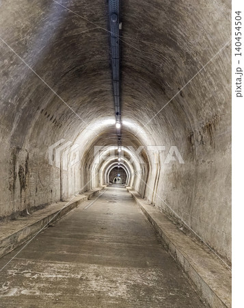 Underground tunnel corridor with lights concrete passage perspective architecture industrial interior walkway Underground tunnel corridor with lights concrete passage perspective architecture industrial interior walkway 140454504